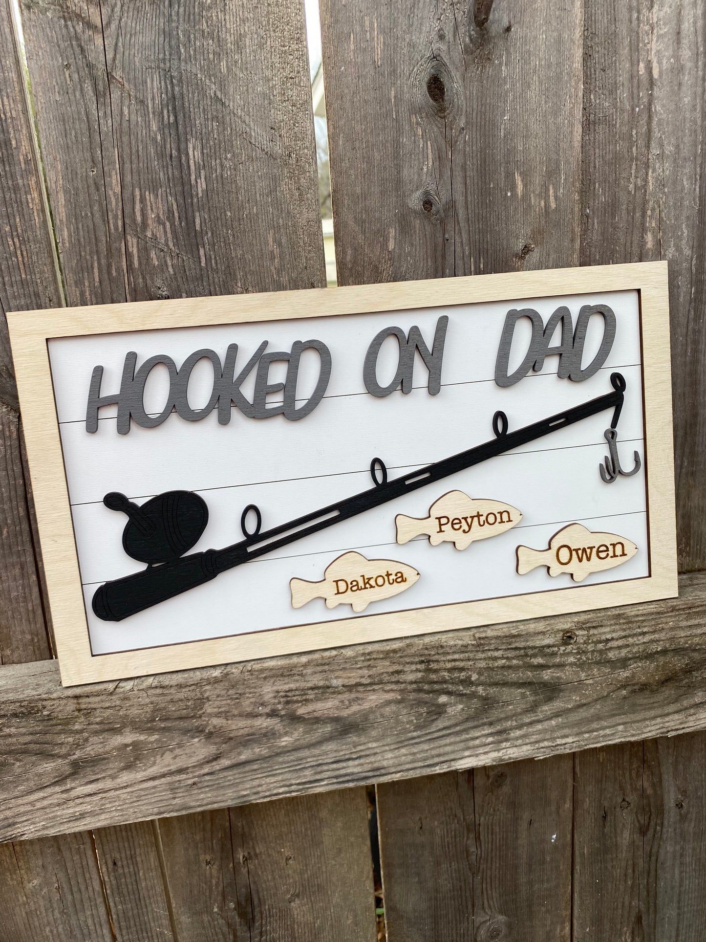 Hooked on dad sign