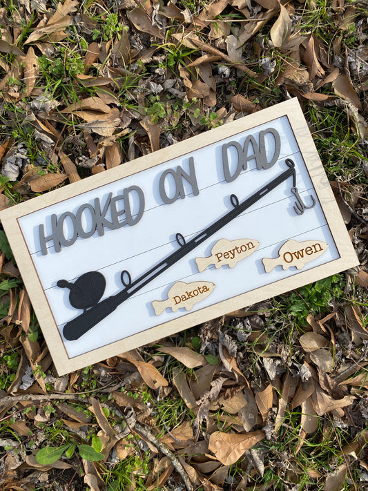 Hooked on dad sign