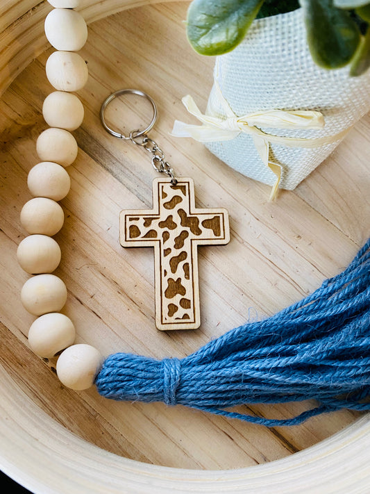 Cow print cross keychain