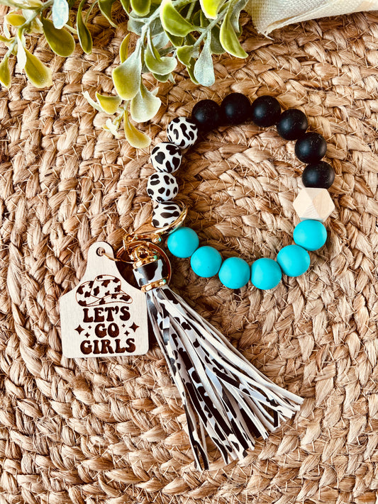 Let’s go girls cow tag wristlet